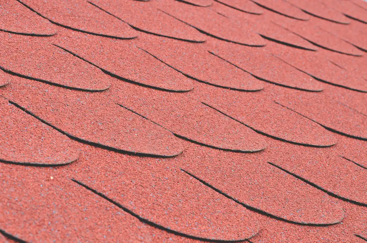 Red asphalt shingle roof on a house
